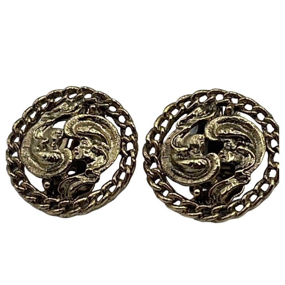 Vintage Kramer gold colored cut out design clip earrings.